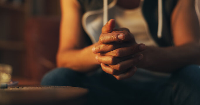 Hands held together, representing support, care, and emotional well-being.